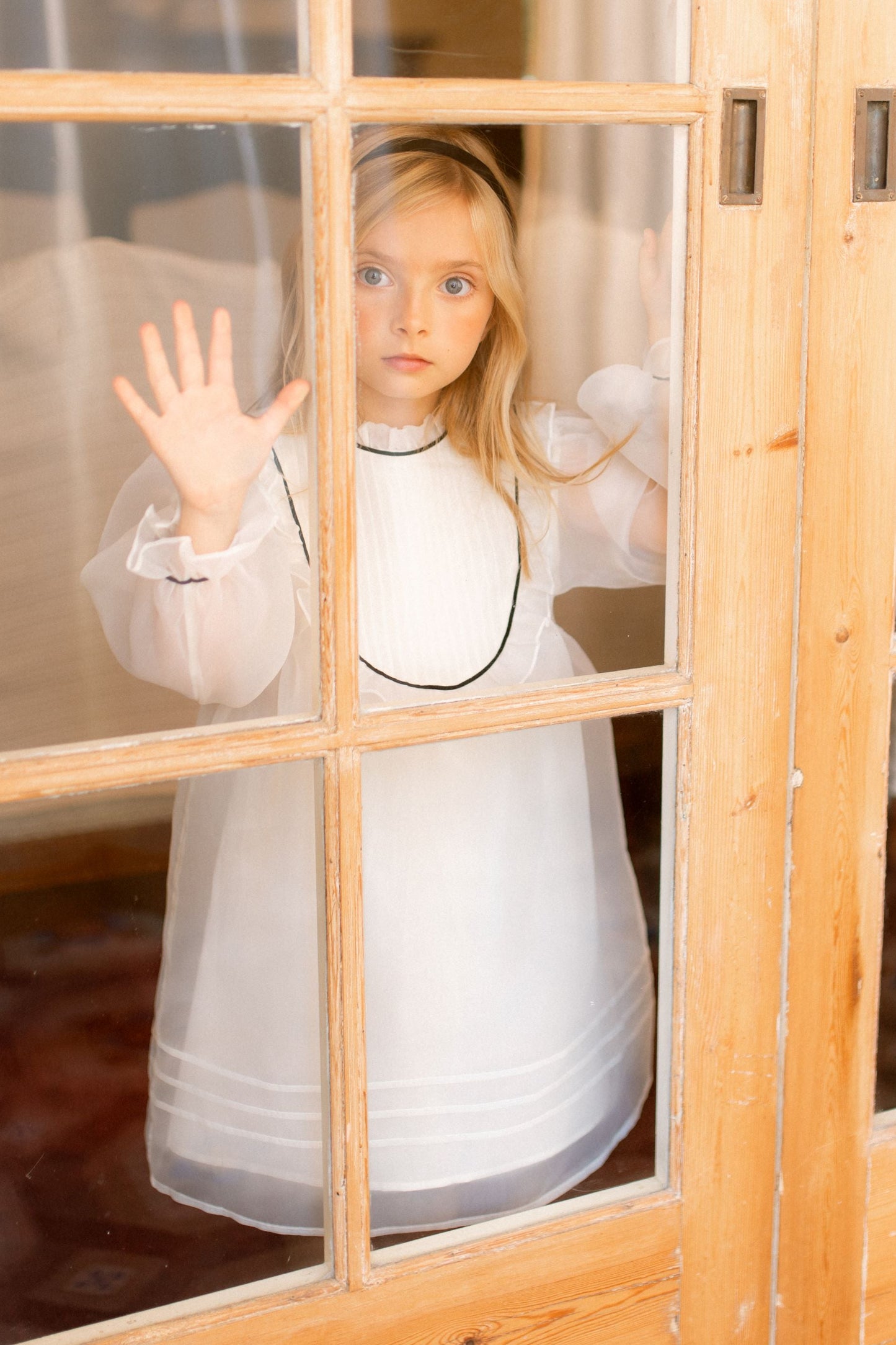 CERA UNA VOLTA CREAM/BLACK TRIM ORGANZA RUFFLE BIB DRESS