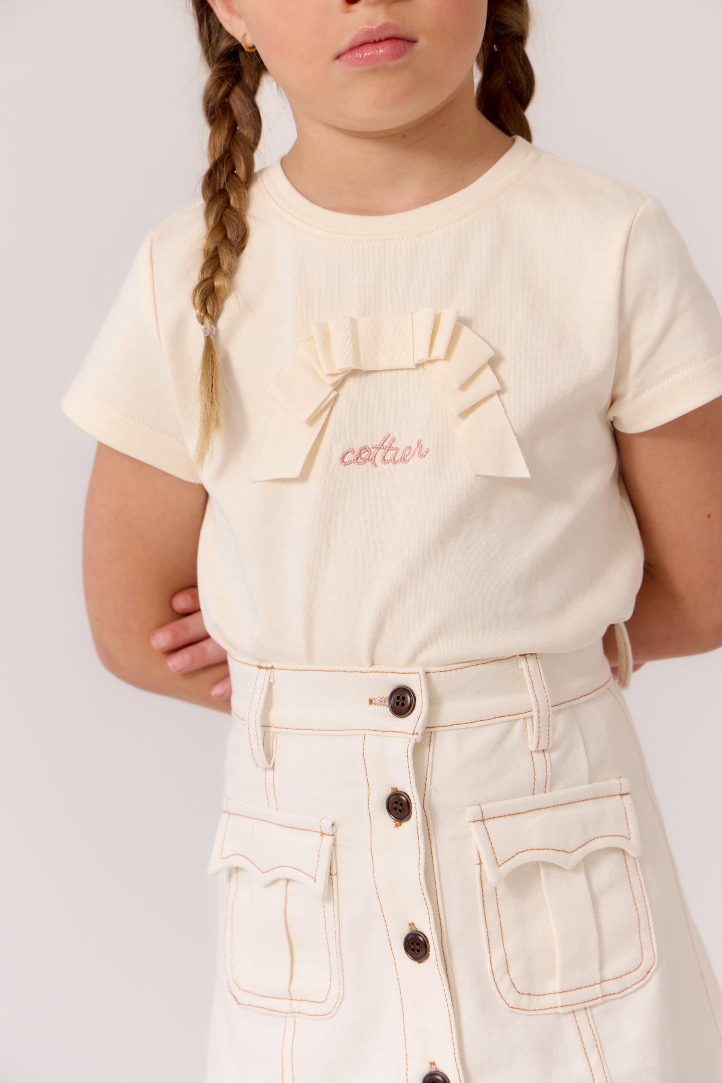 COTTIER CREAM BOW GRAPHIC T-SHIRT