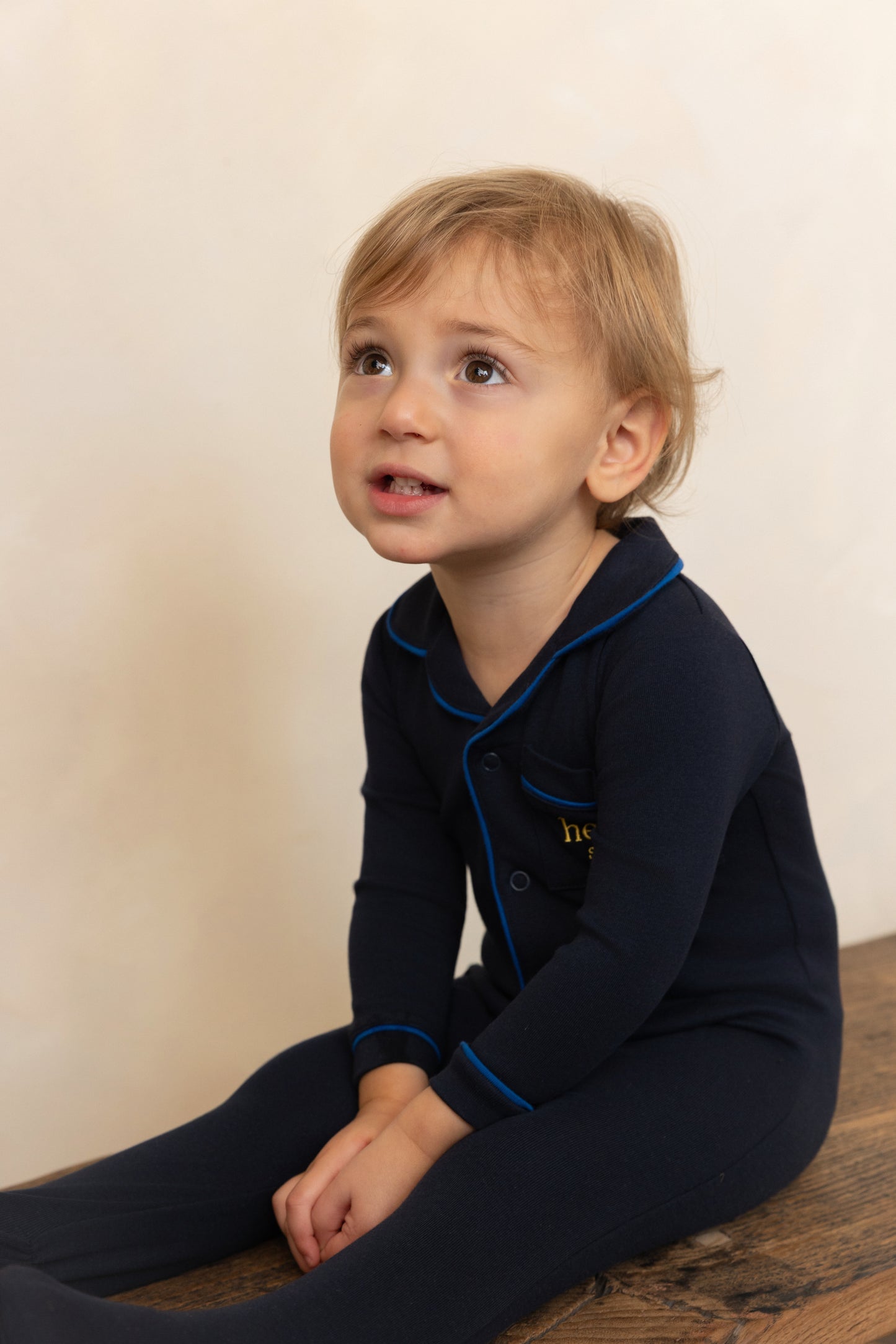 HEVEN CHILD NAVY PIPED TRIM FOOTIE