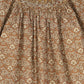 ONE CHILD CAMEL FLORAL PRINT SMOCKED DRESS