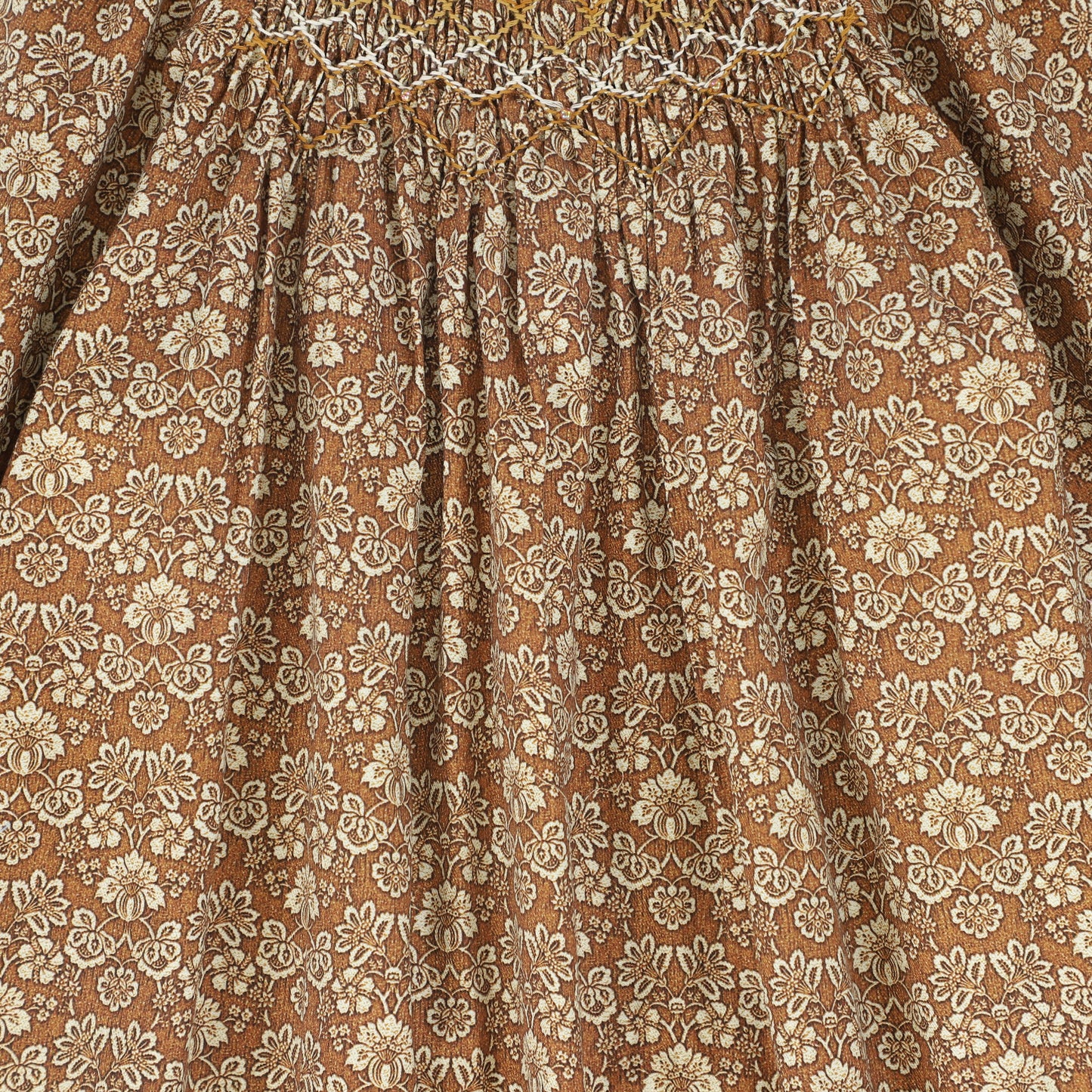 ONE CHILD CAMEL FLORAL PRINT SMOCKED DRESS
