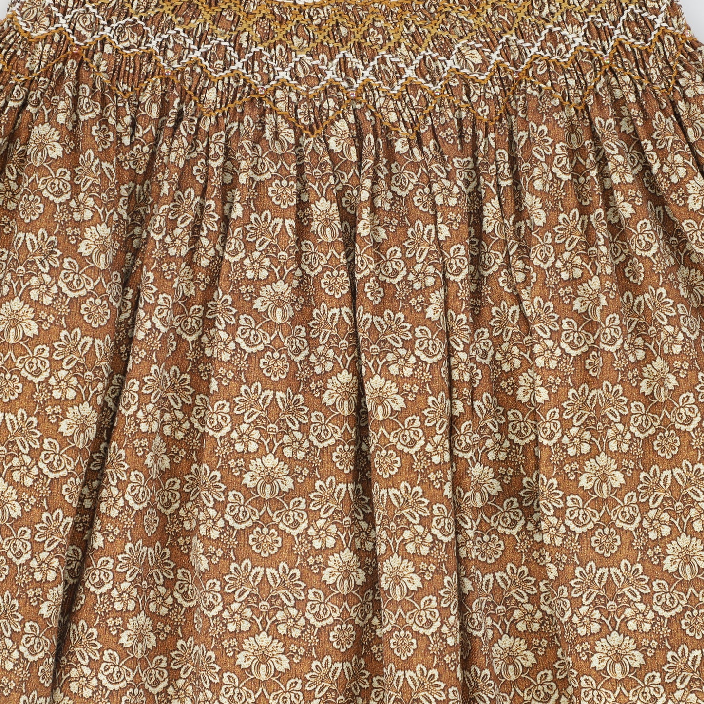 ONE CHILD CAMEL FLORAL PRINT SMOCKED SKIRT
