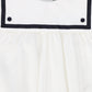 BACE COLLECTION IVORY/NAVY TRIM COLLAR BUTTON ROMPER
