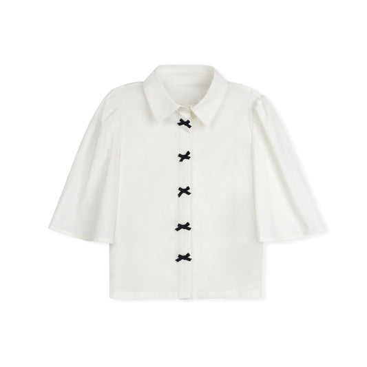 DAINTTI COLLECTION IVORY/NAVY BOW BLOUSE