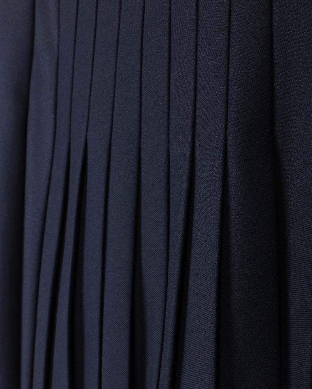 TUSTELLO NAVY PLEATED ASYMMETRICAL SKIRT