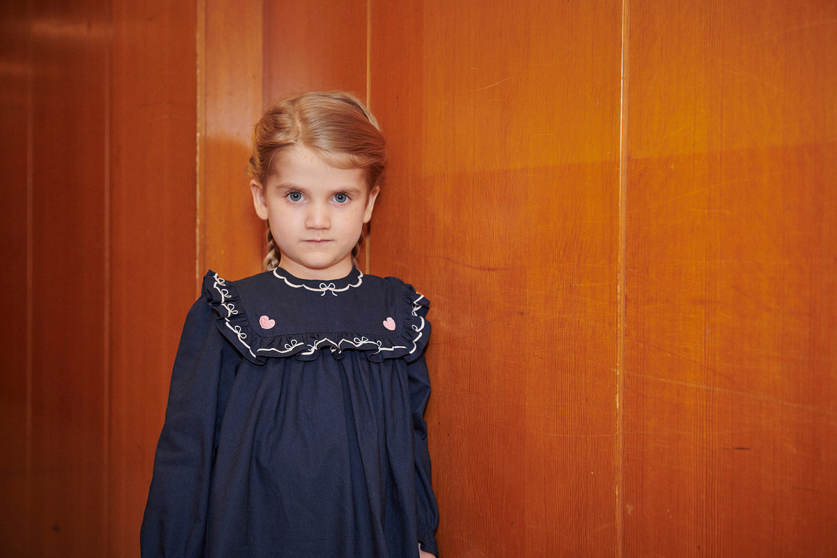 COPENHAGEN COLOR NAVY EMBROIDERED BIB DRESS
