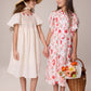 PERNILLE IVORY/RED FLORAL SMOCK FLUTTER SLEEVE DRESS