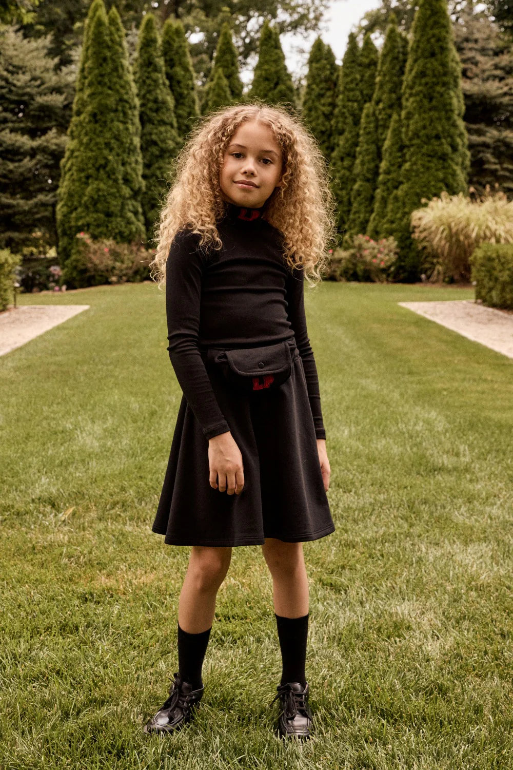 LITTLE PARNI BLACK LOGO POUCH SKIRT